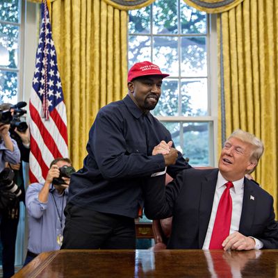Rapper Kanye West, left, shakes hands with U.S. President Donald Trump during a meeting in the Oval Office of the White House in Washington, D.C., U.S., on Thursday, Oct. 11, 2018.