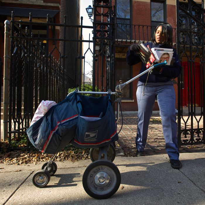 United States Postal Service Letter Carrier Lakesha Dortch-Hardy delivers mail in Chicago, November 29, 2012.United States Postal Service Letter Carrier Lakesha Dortch-Hardy delivers mail in Chicago, November 29, 2012.
