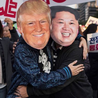 Demonstrators dressed as North Korean leader Kim Jong-Un (R) and US President Donald Trump (L) embrace during a peace rally in Seoul on November 5, 2017. (ED JONES/AFP/Getty Images)