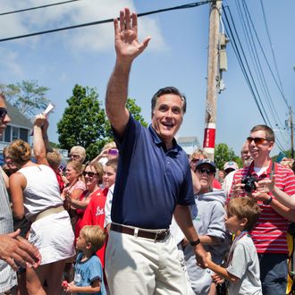 Republican presidential candidate, former Massachusetts Gov. Mitt Romney participates during the Wolfeboro Independence Day parade on July 4, 2012 in Wolfeboro, New Hampshire. The Romney's took a break from their vacation to march in the parade. 