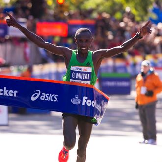 Geoffrey Mutai of Kenya crosses the finish line to win the ING New York City Marathon November 6, 2011 in New York. Mutai, the 2011 Boston Marathon winner, won the men's New York Marathon in an unofficial time of two hours, five minutes and five seconds to smash the course record on Sunday. Mutai smashed the old mark of 2:07:43 set by Ethiopia's Tesfaye Jifar in 2001 to defeat runner-up Emmanuel Mutai, the reigning London Marathon champion. AFP PHOTO/DON EMMERT (Photo credit should read DON EMMERT/AFP/Getty Images)