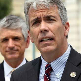 U.S. Rep. Joe Walsh (R-IL) (R) speaks as Rep. Scott Rigell (R-VA) (L) listens during a news conference to announce the formation of the 'Fix Congress Now Caucus' May 16, 2012 on Capitol Hill in Washington, DC.