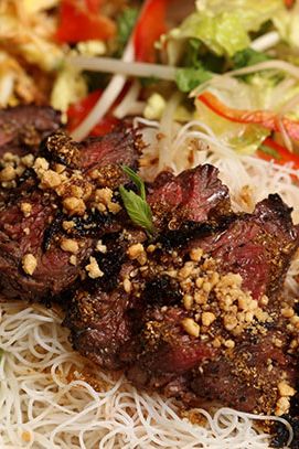 Cold Vermicelli Noodles with Grilled Steak with a Sweet Coriander Soy Glaze, Romaine, Sprouts, Eggs, Herbs, Crushed Peanuts, and House Dressing