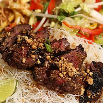 Cold Vermicelli Noodles with Grilled Steak with a Sweet Coriander Soy Glaze, Romaine, Sprouts, Eggs, Herbs, Crushed Peanuts, and House Dressing