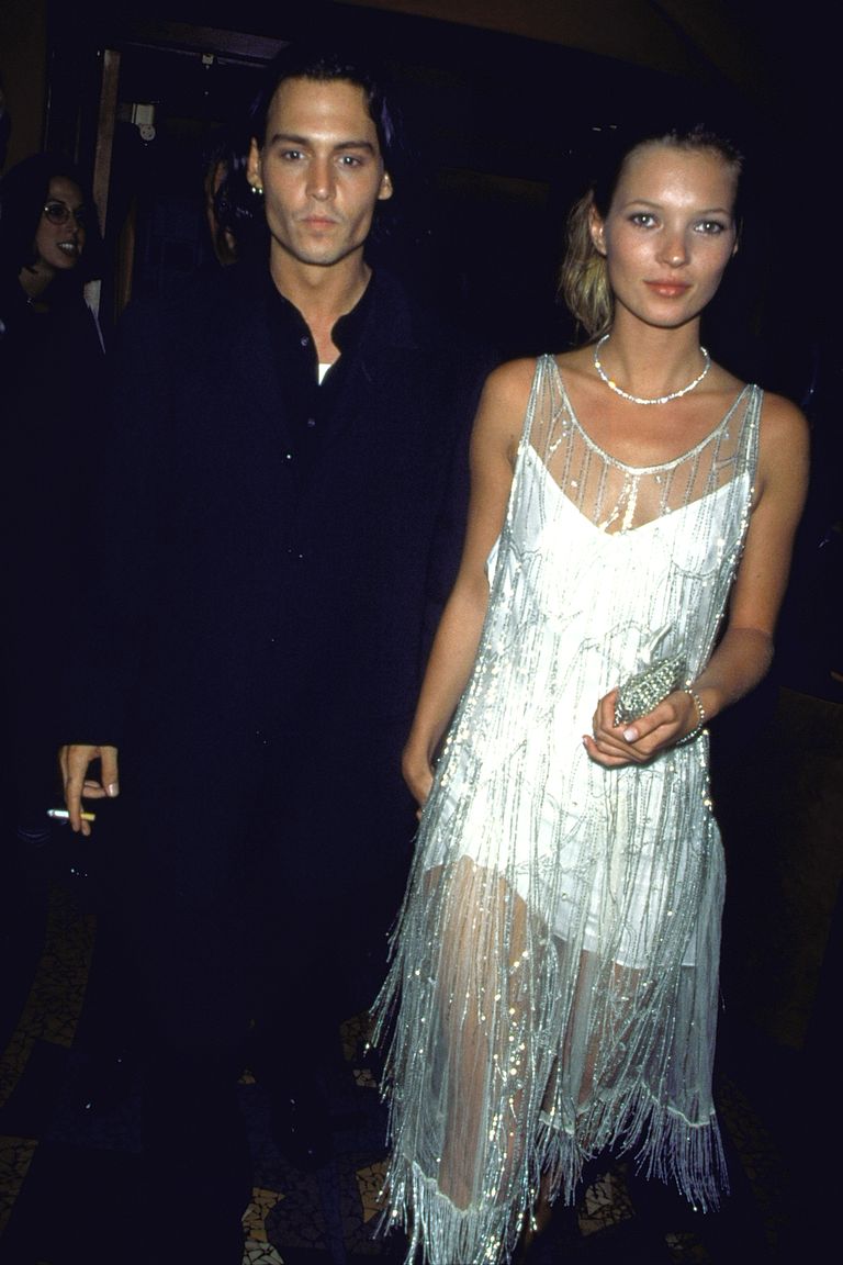 (L-R) Actor Johnny Depp w. girlfriend model Kate Moss wearing silk slip Calvin Klein dress covered by vintage beaded flapper’s chemise once owned by Mrs. Errol Flynn.  (Photo by Dave Allocca/DMI/Time Life Pictures/Getty Images)