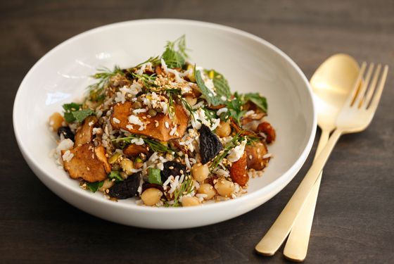 Lentils, basmati rice, and chickpeas with pistachios, rainbow carrots, ricotta salata, sunchoke chips, and herbs.