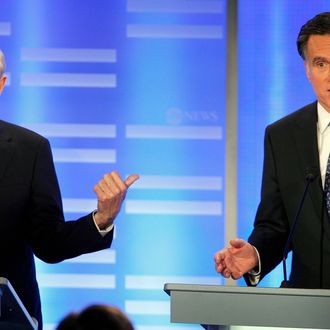 Rep. Ron Paul, R-Texas, points to former Massachusetts Gov. Mitt Romney as he answers a question during a Republican presidential candidate debate at Saint Anselm College in Manchester, N.H., Saturday, Jan. 7, 2012. (AP Photo/Elise Amendola)