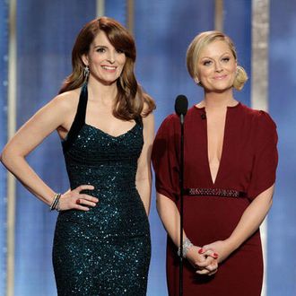 70th ANNUAL GOLDEN GLOBE AWARDS -- Pictured: (l-r) Tina Fey, Amy Poehler, hosts on stage during the 70th Annual Golden Globe Awards held at the Beverly Hilton Hotel on January 13, 2013.