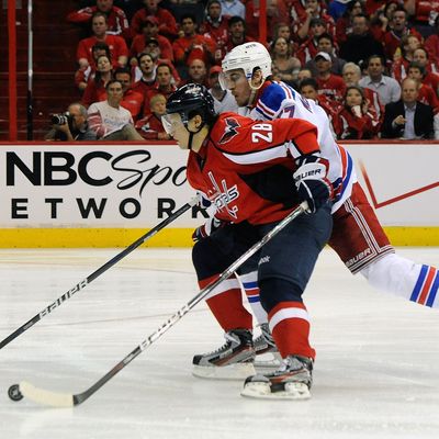 Alexander Semin #28 of the Washington Capitals and Ryan McDonagh #27 of the New York Rangers battle for the puck in Game Three of the Eastern Conference Semifinals during the 2012 NHL Stanley Cup Playoffs at the Verizon Center on May 2, 2012 in Washington, DC.