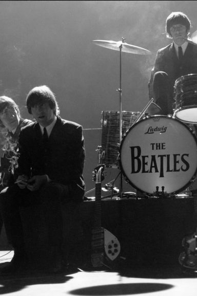 George Harrison, John Lennon, and Ringo Starr smoke on set at Granville Studio.