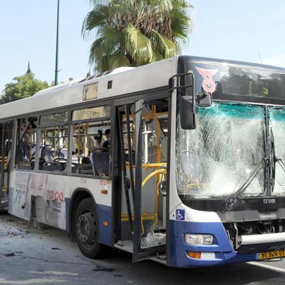 A general view of the scene after a bus exploded with passengers onboard on November 21, 2012 in central Tel Aviv, Israel. At least ten people have been injured in a blast on a bus near military headquarters in what is being described as terrorist attack which threatens to derail ongoing cease-fire negotiations between Israeli and Palestinian authorities.