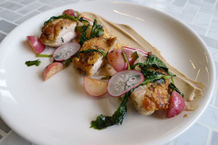 Chicken thigh with cashew yogurt, soy-roasted radish, and frico crumble.