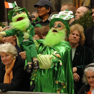 Parade-goers watch the 251st St Patrick's Day Parade up 5th Avenue in New York on March 17, 2012. AFP PHOTO / TIMOTHY A. CLARY (Photo credit should read TIMOTHY A. CLARY/AFP/Getty Images)