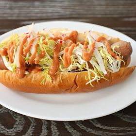 DISH: DBGB Dog, $9 Boulud's own American-style dog is a house beef frank, served with sautéed onion, mustard, ketchup, 299 relish (the restaurant's secret sauce), and a side of fries.We figured it was unfair to have Boulud rank his own dog against the competition, but needless to say, he's a fan: "You get the fire of the sauce, you get the smokiness. What's good with this is sweet and sour, spicy and meaty, and the bread brings a little bit of balance," the chef explains.