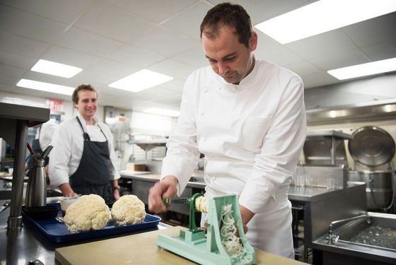 Humm, prepping cauliflower stemps in the EMP kitchen.