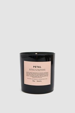 Boy Smells Scented Candle in Petal