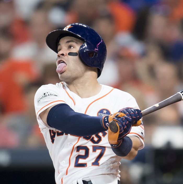 Jose Altuve #27 of the Houston Astros hits a home run, his third of the game, against the Boston Red Sox in the seventh inning of game one of the American League Division Series at Minute Maid Park on October 5, 2017 in Houston, Texas.