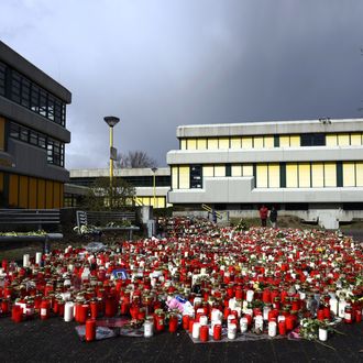 A man mourns by a memorial of flowers and candles in front of the Joseph-Koenig-Gymnasium secondary school in Haltern am See, western Germany on April 1, 2015, from where some of the Germanwings plane crash victims came. A church service will take place in the small western German town of Haltern to remember 16 pupils and two teachers from the same school who were killed in the Germanwings air disaster as they returned from an exchange trip to Barcelona. AFP PHOTO / SASCHA SCHUERMANN (Photo credit should read SASCHA SCHUERMANN/AFP/Getty Images)