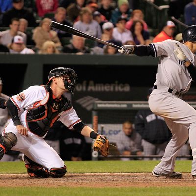 Raul Ibanez #27 of the New York Yankees follows his game winning RBI double