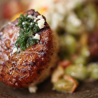 With ​edamame, corn, bell pepper, cotja cheese, and mojo