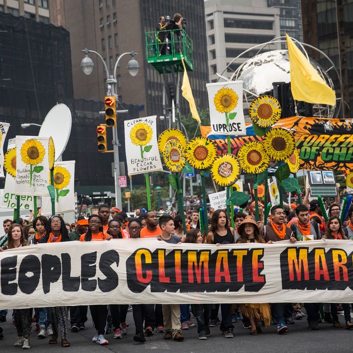 NEW YORK, NY - SEPTEMBER 21: People protest for greater action against climate change during the People's Climate March on September 21, 2014 in New York City. The march, which calls for drastic political and economic changes to slow global warming, has been organized by a coalition of unions, activists, politicians and scientists. (Photo by Andrew Burton/Getty Images)