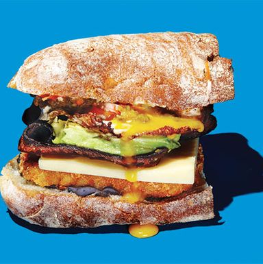 ABV’s Breakfast Torta
$10; 1504 Lexington Ave., at 97th St.; 212-722-8959
Corey Cova’s latest concoction: expertly fried egg, husky strips of bacon, a slab of melted Cheddar, avocado, miso mayo, jalapeño relish, black-bean purée, and the coup de grâce—a housemade hash-brown patty the size of an iPhone that’s even better than Mickey D’s. The people who put French fries on sandwiches and consider it a trashy triumph have nothing on Cova.