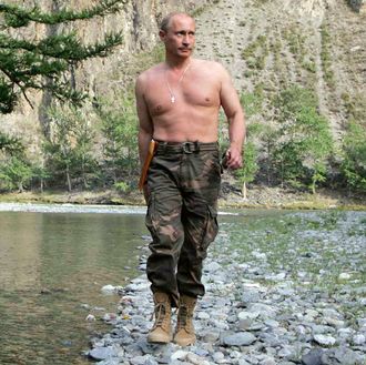  Russian President Vladimir Putin walking in the Khemchik River.