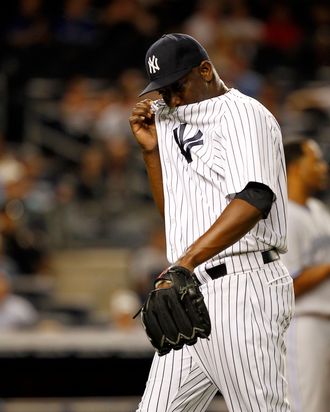 Rafael Soriano #29 of the New York Yankees reacts after giving up a three-run home run to Colby Rasmus #28 of the Toronto Blue Jays at Yankee Stadium on August 27, 2012 in New York City. 