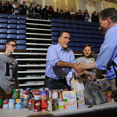 US Republican presidential candidate Mitt Romney helps collect and pack donated goods as he attends a storm relief campaign event to help people who suffered from storm Sandy, in Kettering, Ohio, on October 30, 2012. The death toll from superstorm Sandy has risen to 32 in the mainland United States and Canada, and was expected to climb further as several people were still missing, officials said. Officials in the US states of Connecticut, New York, New Jersey, Maryland, Pennsylvania, West Virginia and North Carolina all reported deaths from the massive storm system, while Toronto police said a Canadian woman was killed by flying debris.