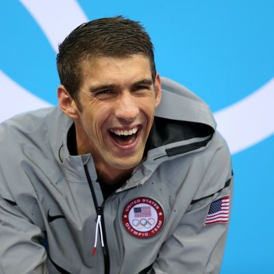 Gold Medallist Michaell Phelps of the United States smiles prior to receiving his medal on the podium during the medal ceremony for the Men's 4 x 200m Freestyle Relay final on Day 4 of the London 2012 Olympic Games at the Aquatics Centre on July 31, 2012 in London, England.