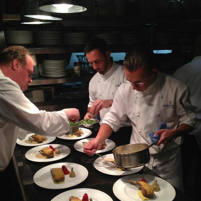 Elena, left, plates a meal in the kitchen at Chefs Club Aspen.