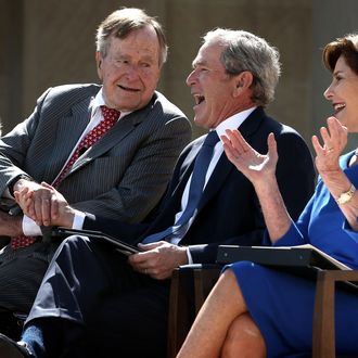 DALLAS, TX - APRIL 25: Former U.S. President George W. Bush (3rd L) shaks hands with his father former President George H.W. Bush (2nd L) as they attend the opening ceremony of the George W. Bush Presidential Center with his wife, former first lady Laura Bush (R), and his mother, former first lady Barbara Bush (L), April 25, 2013 in Dallas, Texas. The Bush library, which is located on the campus of Southern Methodist University, with more than 70 million pages of paper records, 43,000 artifacts, 200 million emails and four million digital photographs, will be opened to the public on May 1, 2013. The library is the 13th presidential library in the National Archives and Records Administration system. (Photo by Alex Wong/Getty Images)