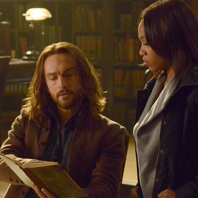 SLEEPY HOLLOW: Ichabod (Tom Mison, L) and Abbie (Nicole Beharie, R) look for a dangerous book of spells in the 