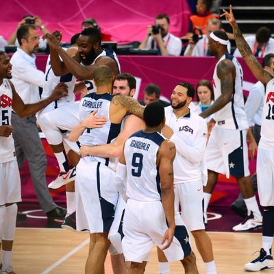 US players celebrate after the London 2012 Olympic Games men's gold medal basketball game between USA and Spain at the North Greenwich Arena in London on August 12, 2012.