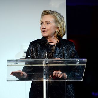 NEW YORK, NY - OCTOBER 16: (L-R) Hillary Rodham Clinton, recipient of the Michael Kors Award for Outstanding Community Service, speaks onstage at God's Love We Deliver 2013 Golden Heart Awards Celebration at Spring Studios on October 16, 2013 in New York City. (Photo by Dimitrios Kambouris/Getty Images for Michael Kors)