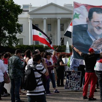 WASHINGTON, DC - SEPTEMBER 09: Organized by the Syrian American Forum (SAF), demonstrators protest against a possible military attack on Syria by the United States outside the White House September 9, 2013 in Washington, DC. The SAF is an independent, not-for-profit organization working 