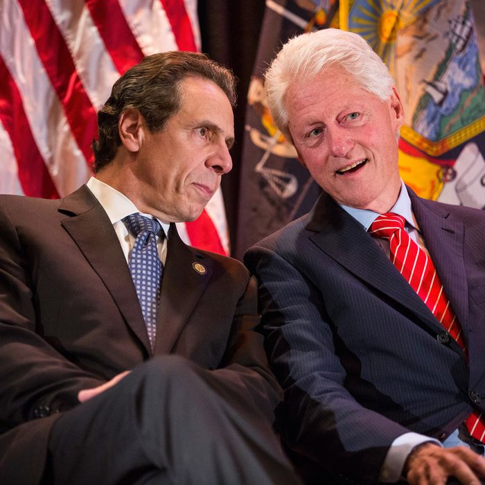 Former U.S. President Bill Clinton (R) speaks with New York State governor Andrew Cuomo (L) at a campaign event to support Cuomo's reelection October 30, 2014 in New York City. Citizens go to the polls next Tuesday, November 4. 