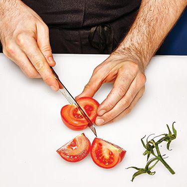 1. Remove stem. With a serrated knife, halve twice.