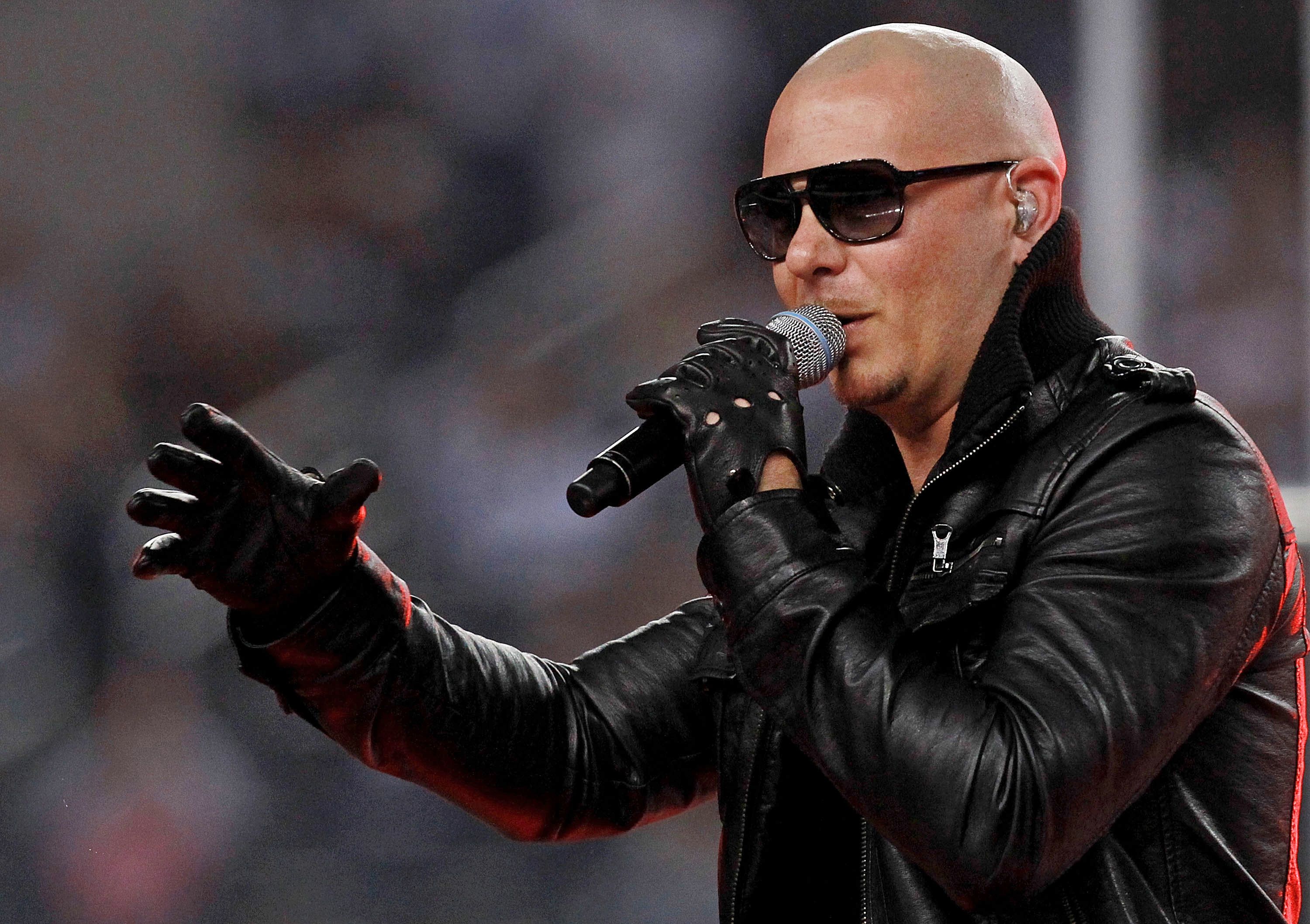 Rapper Pittbull performs during halftime of the Dallas Cowboys and