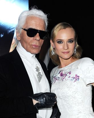 Designer Karl Lagerfeld and actress Diane Kruger attend the 2012 amfAR's Cinema Against AIDS during the 65th Annual Cannes Film Festival at Hotel Du Cap on May 24, 2012 in Cap D'Antibes, France.