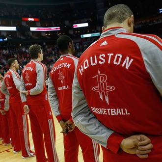  Members of the Houston Rockets stand during the National Anthem before the game against the Los Angeles Clippers at the Toyota Center on March 29, 2014 in Houston, Texas. 