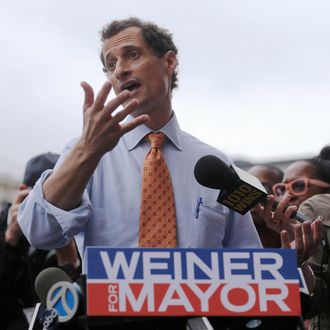 Anthony Weiner (C) speaks to the media after courting voters outside a Harlem subway station a day after announcing he will enter the New York mayoral race on May 23, 2013 in New York City. Weiner is joining the Democratic race to succeed three-term Mayor Michael Bloomberg after he was forced to resign from Congress in 2011 following the revelation of sexually explicit online behavior. 