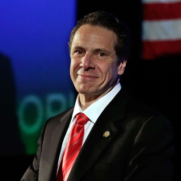 22 May 2014, Huntington, Long Island, New York State, USA --- New York Gov. Andrew Cuomo listens to applause as he's introduced as his party's nominee for re-election, at the state's Democratic Convention, in Melville, N.Y., Thursday, May 22, 2014. In a speech accepting his party's nomination, Cuomo cited his work to pass gay marriage and gun control and called Republicans the party of negativity and fear. (AP Photo/Richard Drew) --- Image by ? Richard Drew/AP/Corbis
