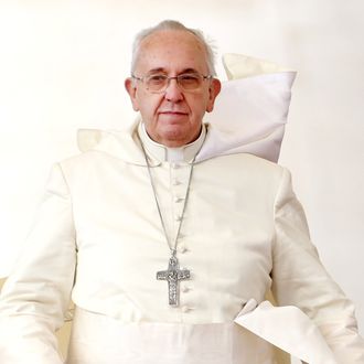 VATICAN CITY, VATICAN - OCTOBER 22: Pope Francis attends his weekly audience in St. Peter's Square on October 22, 2014 in Vatican City, Vatican. Speaking to the crowds gathered in St. Peter's Square for the weekly General Audience, Pope Francis said 'War does not begin on the battlefield: war, wars begin in the heart, with this misunderstanding, division, envy, with this fighting among each other'. (Photo by Franco Origlia/Getty Images)