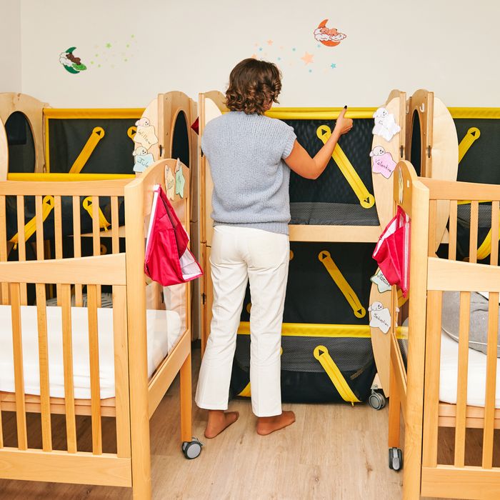 Many infant cribs in nursery or daycare