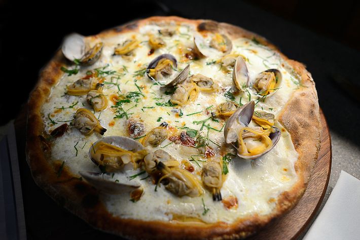 Diners will be given scissors to cut their own vongole pizza, topped with clams, roasted garlic, mozzarella, and herb breadcrumbs.