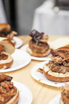 Pork Palooza Burger: Berkshire pork cheek burger, candied cherry smoked pork belly, pulled pork relish, red onion pickles and smokey dijonnaise.