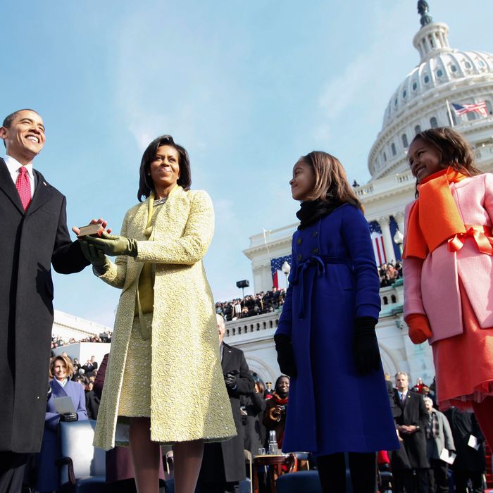 President Barack Obama takes the oath as the 44th U.S. President with his wife, Michelle, by his side at the U.S. Capitol in Washington, D.C., Tuesday, January 20, 2009. 