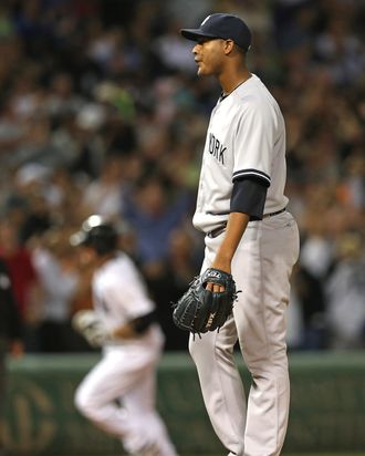 Starting pitcher Ivan Nova #47 of the New York Yankees reacts as Kevin Youkilis #20 of the Chicago White Sox runs the bases after hitting a grand slam home run in the 5th inning at U.S. Cellular Field on August 21, 2012 in Chicago, Illinois.