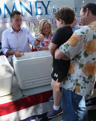 Republican Presidential candidate, former Massachusetts Governor Mitt Romney and his wife Ann Romney scoop ice cream for people during a campaign event at the Milford Ice Cream Social on June 15, 2012 in Milford, New Hampshire. Mr. Romney is starting a five day swing through battle ground states as he battles President Barack Obama for votes.
